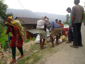 Locals carry away their share of food materials