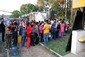Fetching Water in Camp