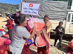 Tarpaulin distribution to earthquake victims