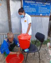 A patient a Baruwa clinic (old) with PHASE staff