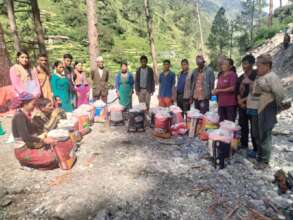 Flood-affected family receiving food supplies