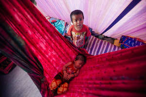 Som's children in their makeshift tent.