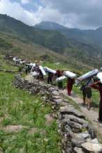 HHC volunteers carry supplies to northern Dhading