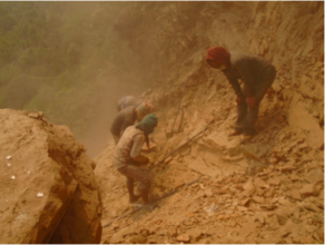 Boulders are broken for use in laying foundation