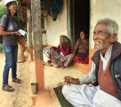 Intern Ulina chats with a family in Nepal