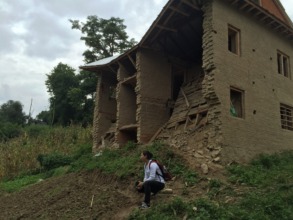 Build Change engineer inspecting damaged building