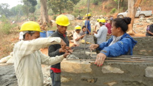 Mason Trainer Demostrating Wall Construction