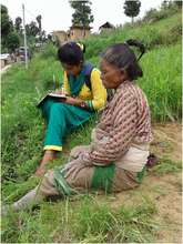 Volunteer listening to an elderly woman's concerns