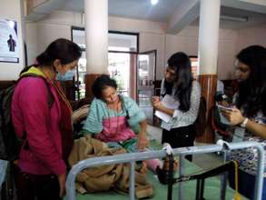 Volunteers gathering citizen feedback at hospital.