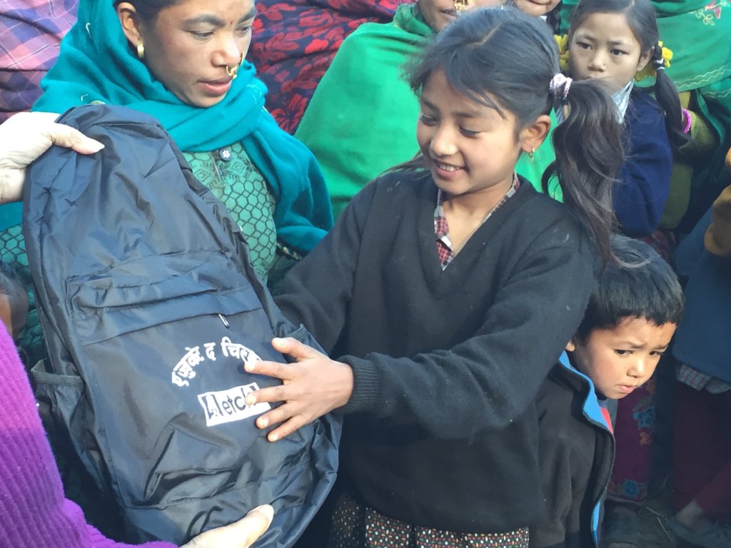 A new backpack full of supplies for a happy girl