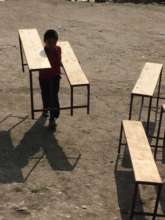 Desk/bench sets - students brought them uphill!