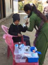 Teacher using ETC-provided first aid kit