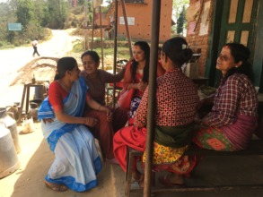 A FCHV talks with women in the Shyampati VDC.