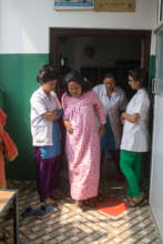 Rachana and her SBAs helping pregnant woman