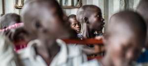 children listening to Nurse Betty teaching