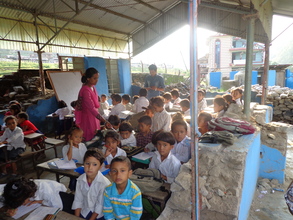 Two teachers teaching  in one  classroom