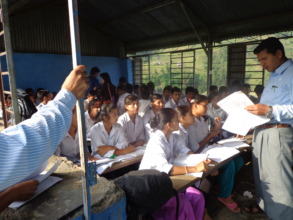 A teacher in the  CLASS ROOM