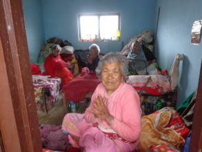 An old woman welcoming us while visiting the home
