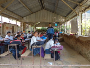 A teacher  supervising the students in  the exam