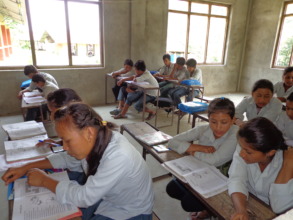 Students reading books in the class