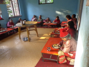elderly people having meals