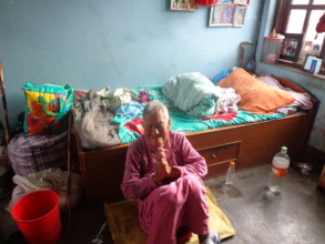 An old woman in her bed room