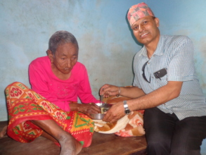 CDC chairperson feed an old woman