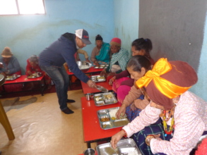 Chairman providing meals to elderly