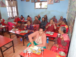 Elderly having their meals happily