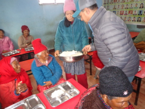 Chairman providing meals to elderly