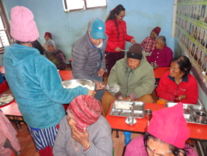 Chairman providing meals to elderly