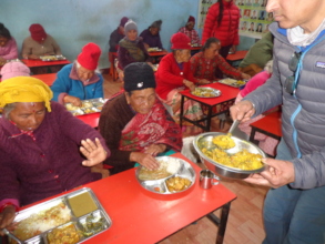 Chairman providing meals to elderly