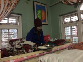 An old woman weak  in her bed