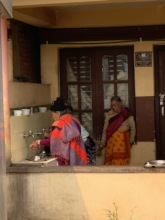 Elderly washing hand before eating
