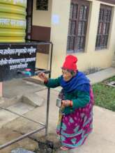 Elderly filling drinking water