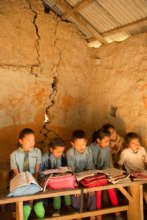 Students in a damaged and unsafe classroom