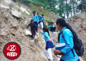 Children cross a landslide on the way to school