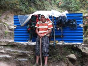 Community member transporting materials