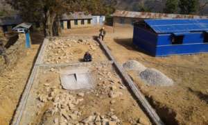 The foundation wall for one of school blocks