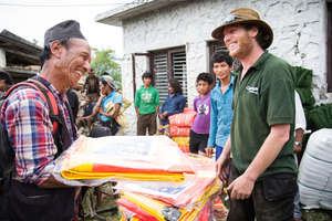 Dom Hunt distributes tarps in Sindhupalchok