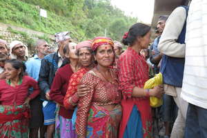 People queuing for tarpolin