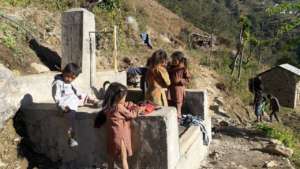 Children at the water supply