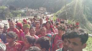 People waiting to receive survival food packages