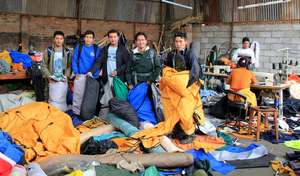 Ground crew collecting tents for distribution