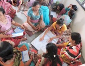 Women learning about budgeted funds