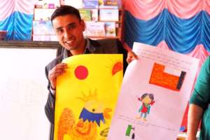 A parent with a book he created at the training.