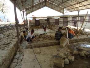 Rebuilding schools is done mostly by hand.
