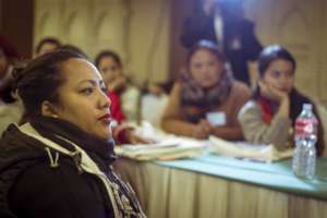 Teachers listening during a training session.