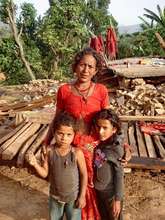 Mother, children and wrecked home.