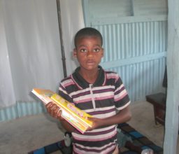 Happy student shows off new books